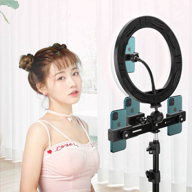 Ring light with smartphone holders on a metal bracket, ideal for selfies and live streaming.