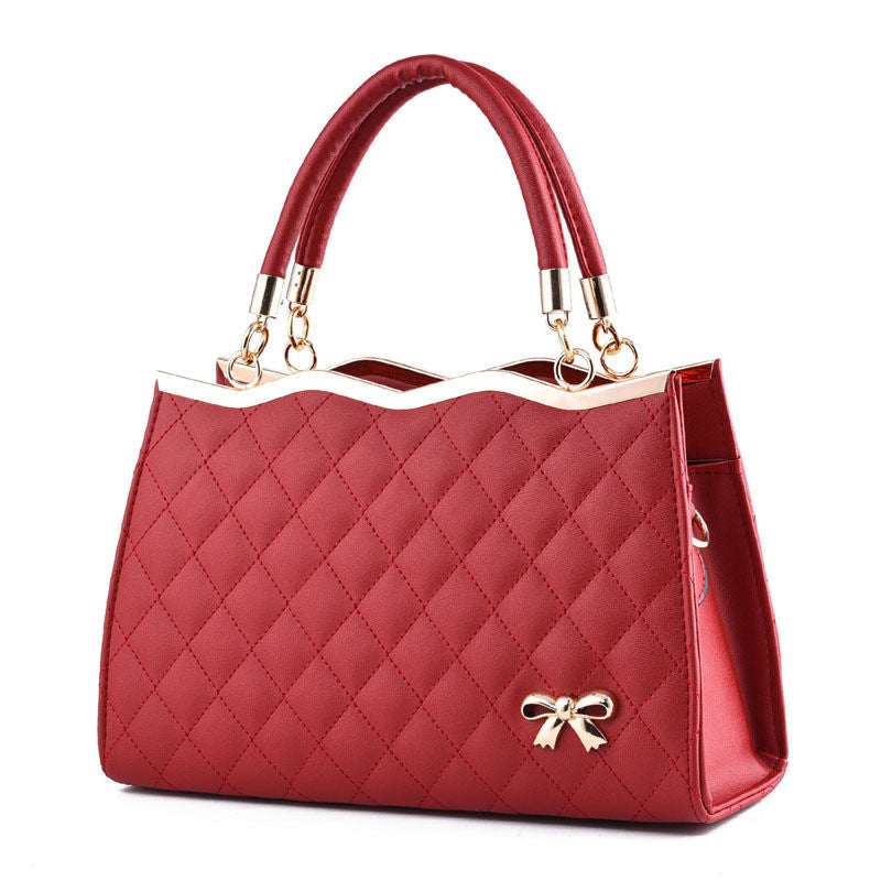 Red convertible crossbody and handle purse, quilted design, PU leather, gold hardware.