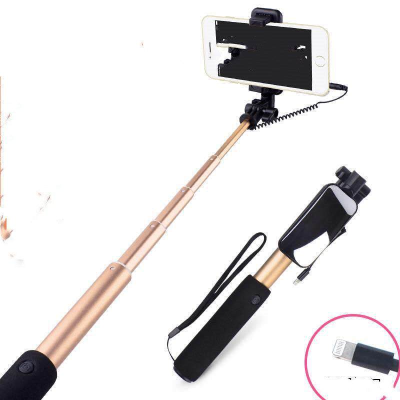 Aluminum alloy selfie stick compatible with Apple devices, shown in rose gold color, with phone attachment and cable.