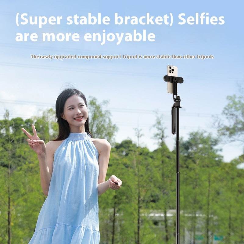 Retractable mobile phone bracket selfie stick with super stable tripod in use outdoors.